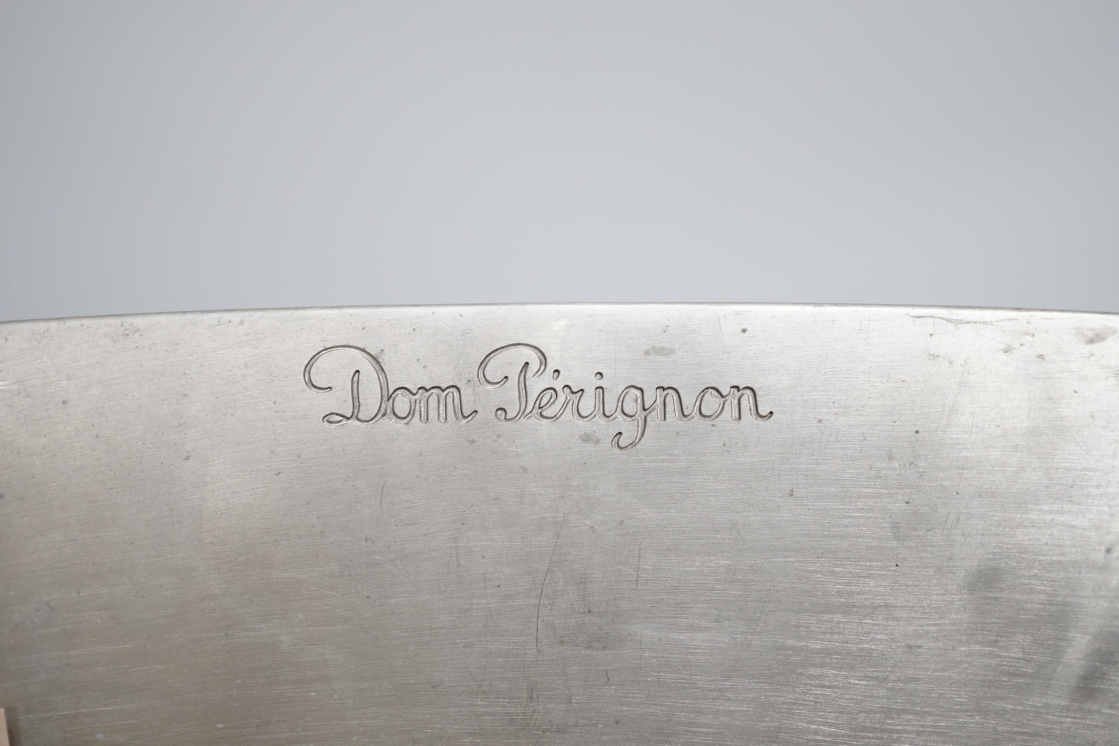 A pair of Dom Perignon pewter wine coolers, designer M Szekely, 21.5cm high x 39cm wide